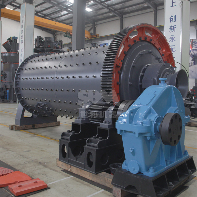Large industrial ball mill used for iron ore grinding in a mineral processing plant